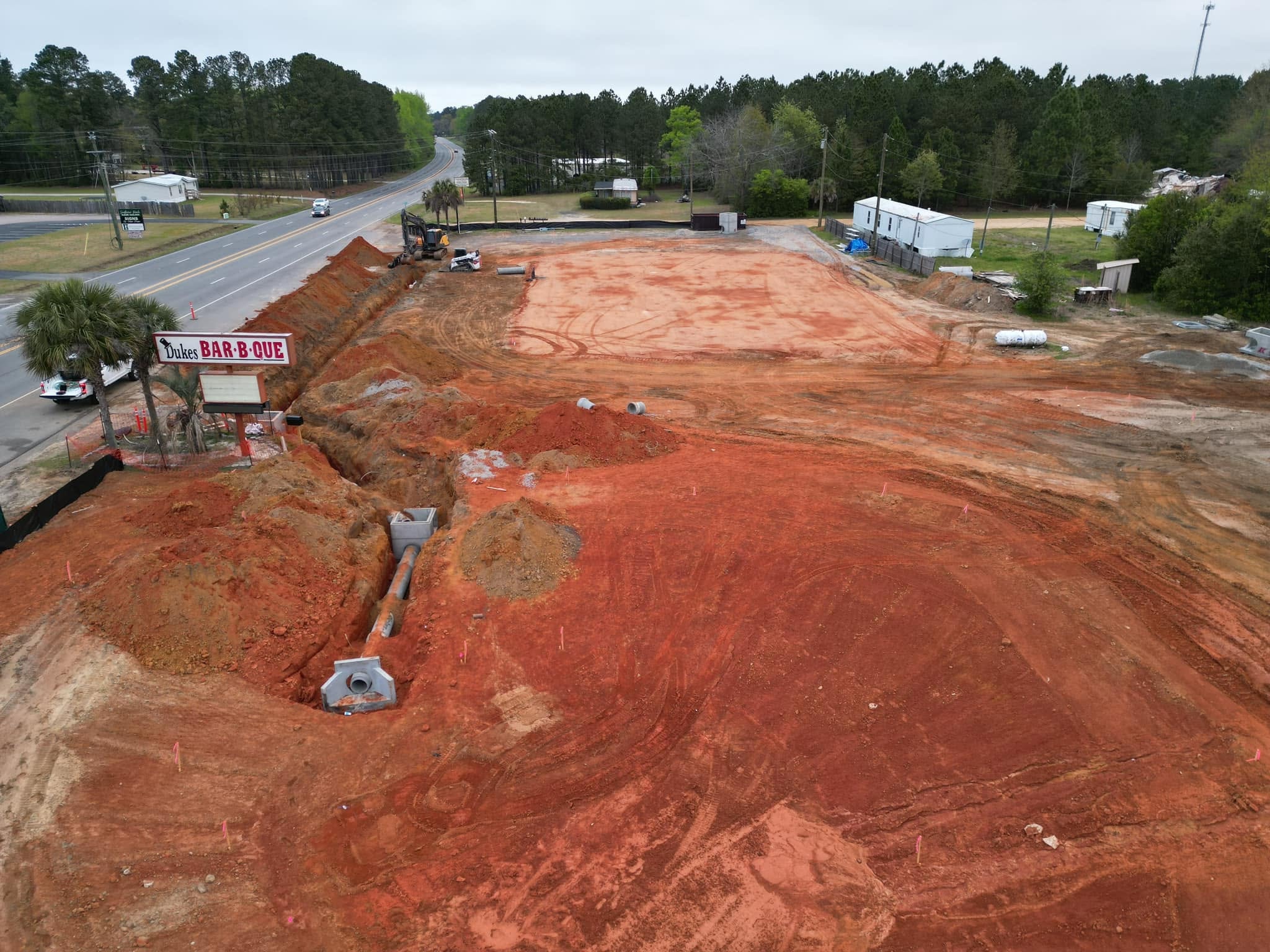 Red clay excavation site with sediment controls