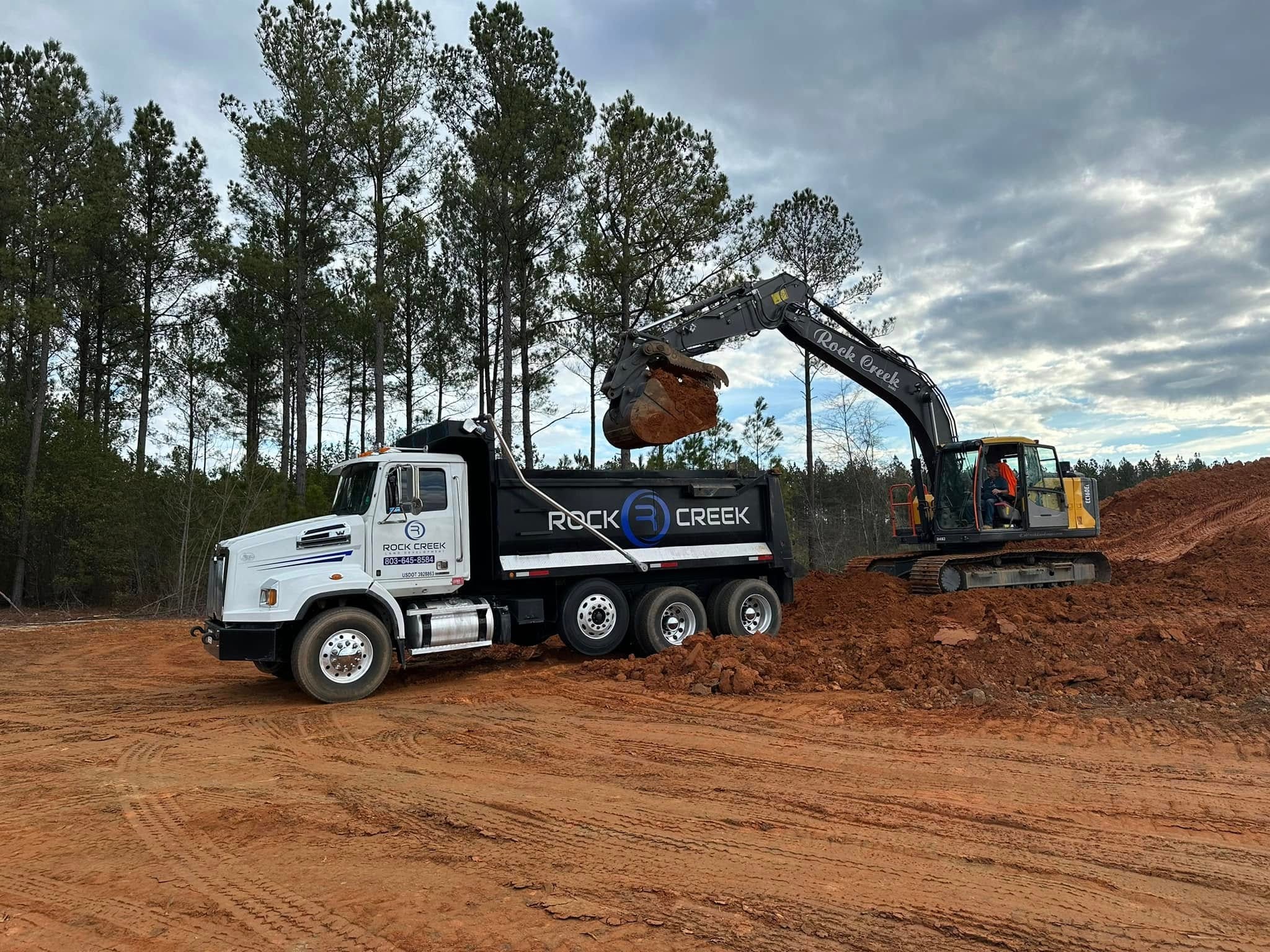 Excavator site work with erosion control